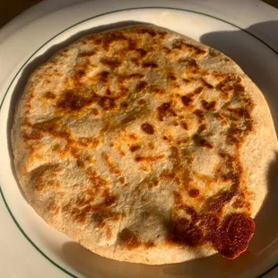 Pupusa with chicharrón, beans and cheese.