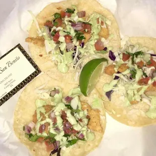 three tacoss with toppings