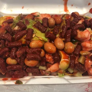 a plate of food in a styrofoam container