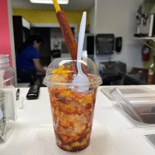 a plastic cup filled with food