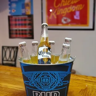 a bucket of beer bottles