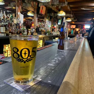 a pint of beer on the bar