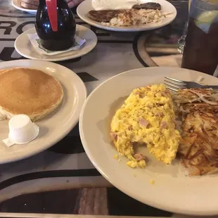 Minced ham n eggs n sharp cheddar with hash browns and side of pancakes!