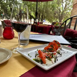 Caprese salad and a lovely glass of house Merlot!  Definitely my happy place in Addison Circle