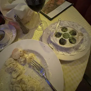 Escargot, Tortellini Alla Panna, glass of wonderful Trivento, Malbec Reserve, Lujan de Cuyo DOC, table bread and garlic olive oil.