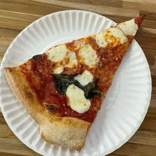 Thin slice- delicious crust- would be better fresh if ordering the whole pie