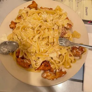 a plate of pasta and shrimp