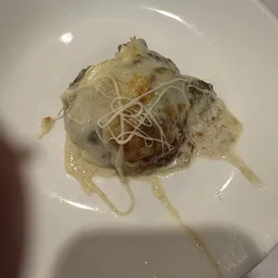 Baked mushroom stuffed with shrimp and crabmeat and covered with provolone.