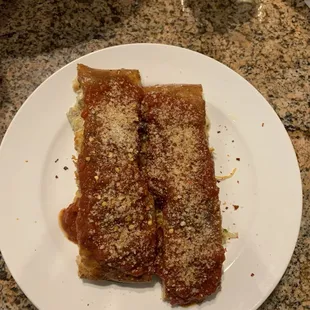 Chicken &amp; Cheese Calzone (After Topping With Marinara, Parmesan Cheese, And Red Pepper Flakes).