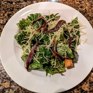 Caesar's salad (with added anchovies) accompany the pasta entrée.