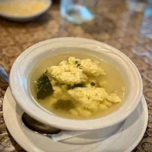 a bowl of soup on a plate