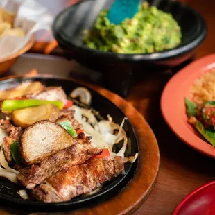 Delicious Fajitas, with rice, beans, guacame,and pico de gallo.