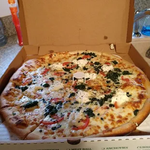 White pizza, spinach &amp; tomatoes.