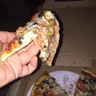 Picked up a slice and all the toppings slid off because the crust was thin and soggy.