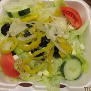 Large Greek Salad as packaged into a clamshell. Note the paucity of feta cheese.☹️