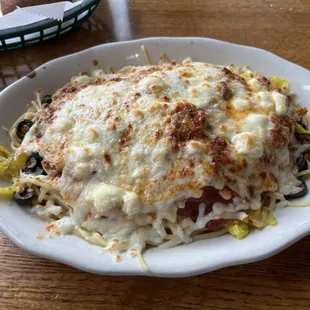 Antonio's Special Greek Spaghetti Dinner: spaghetti with marinara, black olives, banana peppers, feta cheese and mozzarella baked on top.