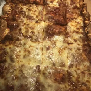 Half a sheet of our full cheese sheet pizza ! Can you say redo!