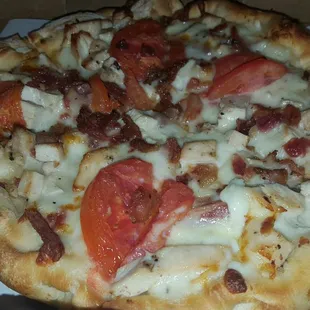 Chicken, bacon, tomatoes with Alfredo sauce - alright.  I like a thinner traditional crust.