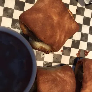 The brown turds we received. Not even Dominos garlic butter sauce could save them