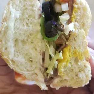 Roast beef sandwich with provolone cheese. Where's the beef? Came with lots of french fries. Out of potato salad and seasonal fruit.