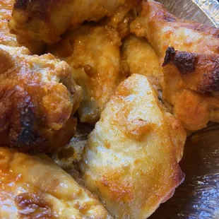 Wings are only crispy on top because he cooks them all on top of each other and doesn't turn them.