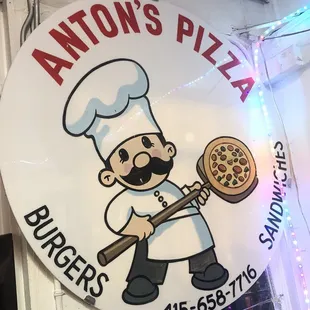 a man holding a pizza