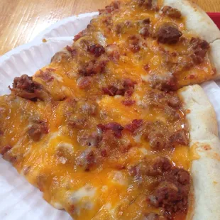 Two cuts of their magnificent Bacon Cheeseburger Pizza