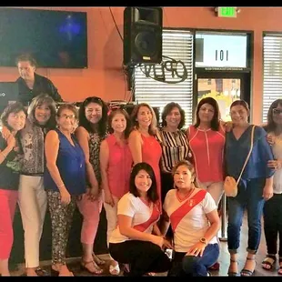 a group of women posing for a picture