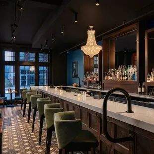 a bar with a chandelier