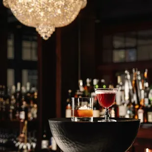 two cocktails on a bar