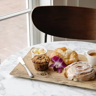 a plate of pastries and a cup of coffee