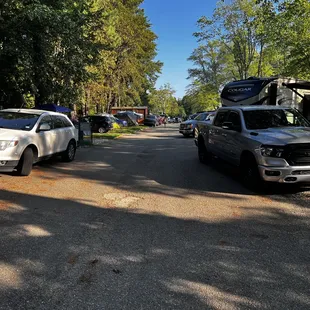 Narrow Street with cars parking in it.
