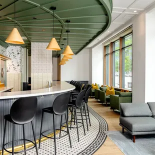 a bar with chairs and a couch