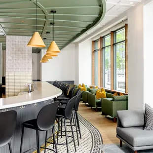 a bar with chairs and a couch