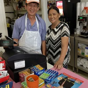 a man and a woman behind a counter