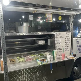 a man standing in front of a food truck