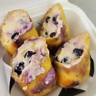 Blueberry Cheesecake Eggrolls  Homemade blueberry cheesecake wrapped in wontons and deep fried. Ooie gooie inside, crispy outside