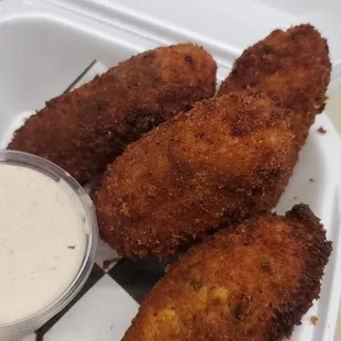 Cajun Fried Jalapeño Poppers  Jalapeño, cream cheese, pepper jack cheese, bacon, and green onions dredged in Cajun panko. Kickin Cajun Sauce