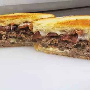 Meatloaf &apos;Wich  Homemade meatloaf, Swiss cheese, and provolone cheese on toasted sourdough bread. Add bacon or a fried egg