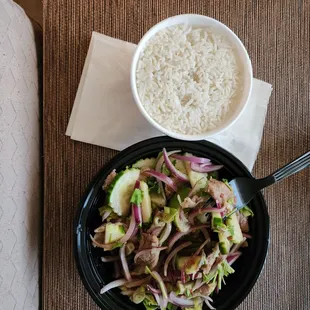 Beef salad with a side of white rice.