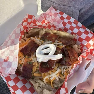 Classic baked potato with cheese bacon and sour cream