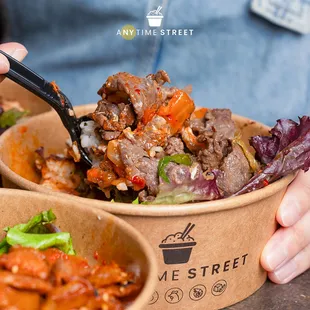 a person eating a bowl of food