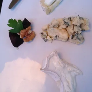 three cheese plate with accompaniments