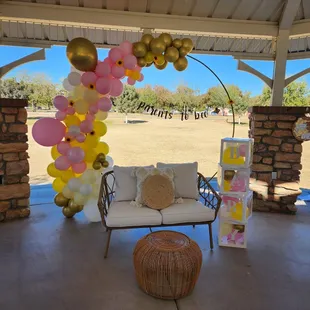 Boho loveseat with pillows and small wicker table