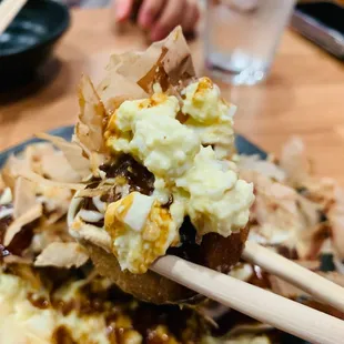 Takoyaki heaped with bonito and egg salad