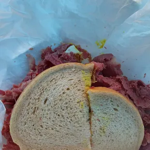 a sandwich in a paper bag