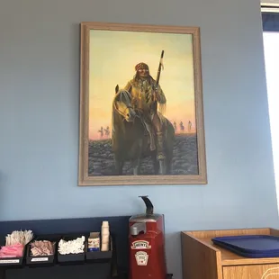 a painting of a man riding a horse