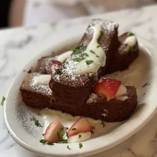 a plate of food with strawberries and cream