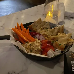 Black Eyed Pea Hummus, Seasonal Vegetables, Toasted Pita Bread.