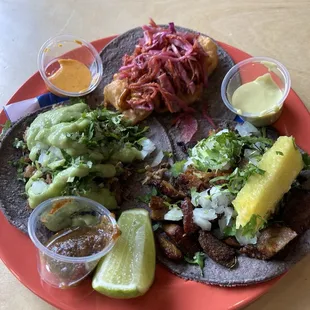 One taco suadero, one shrimp taco, and one taco al pastor